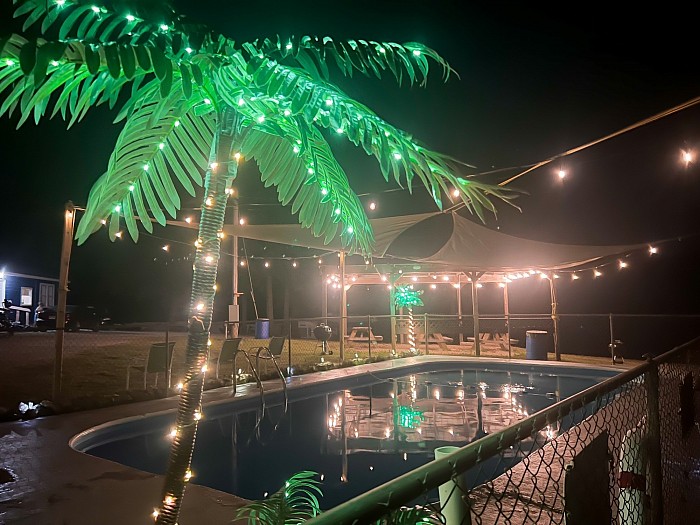 blue waters resort pool at night